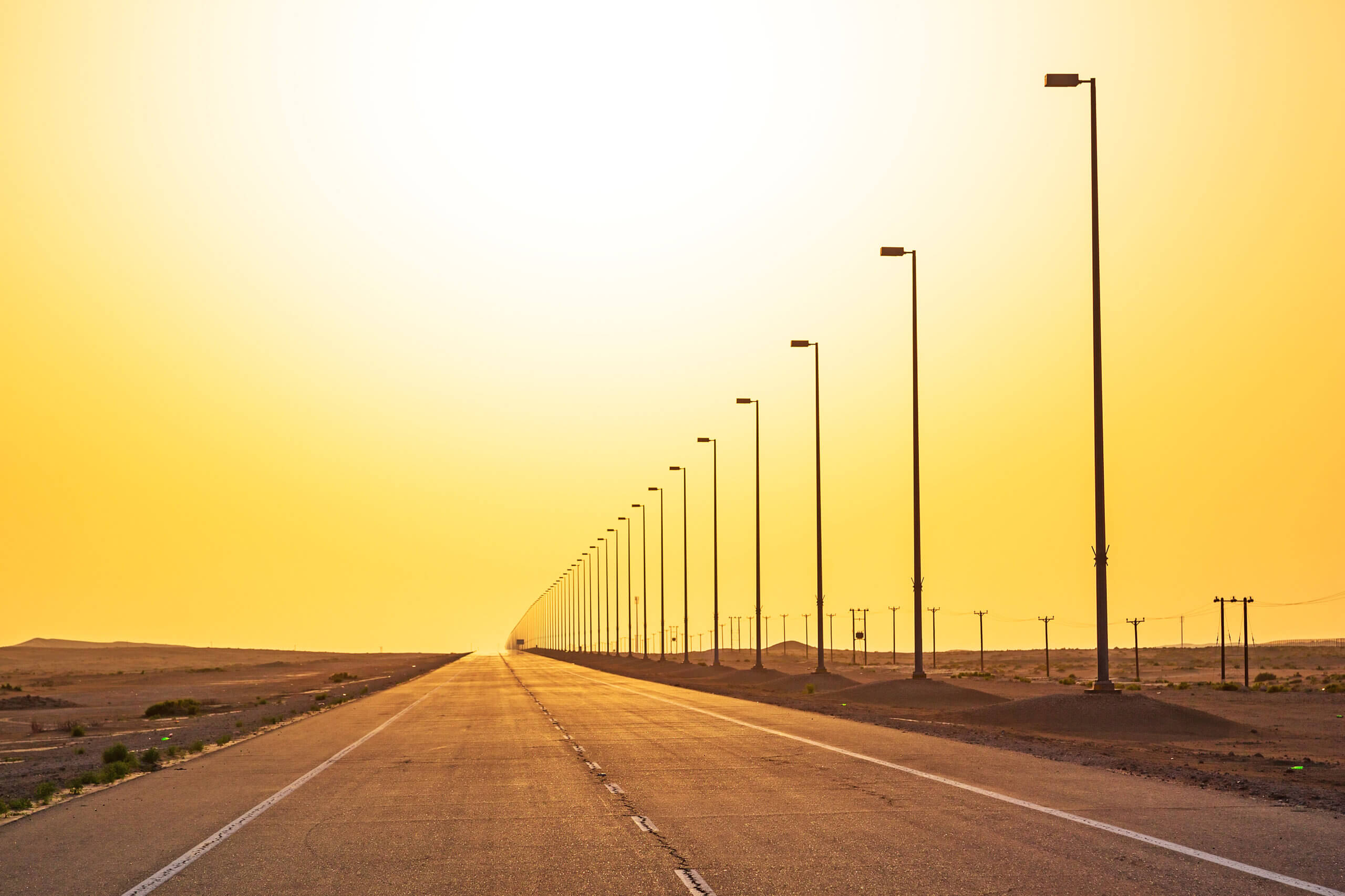 Image shows road into the desert in Saudi Arabia