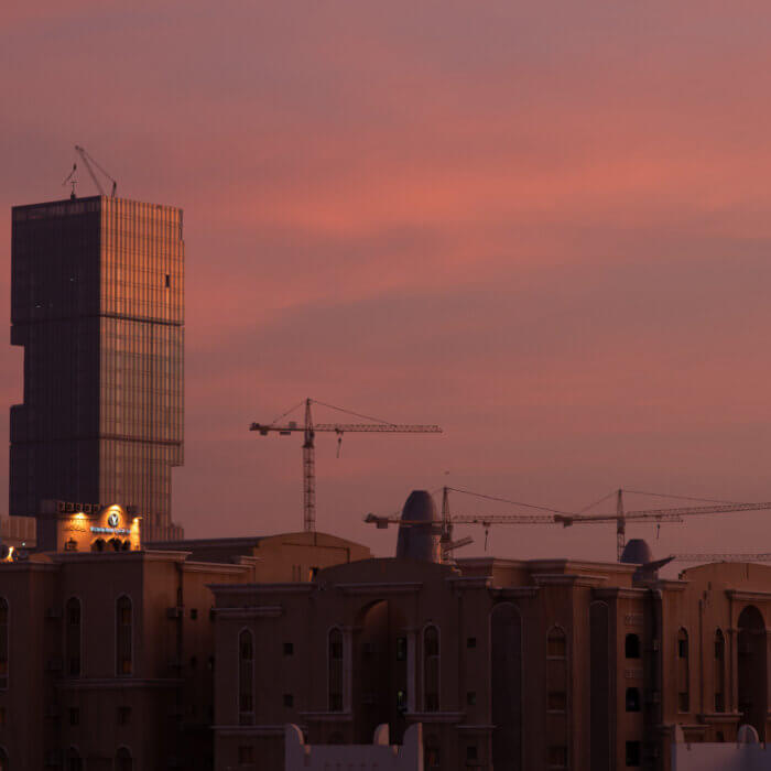 View of cranes and half finished towers in Doha, Qatar