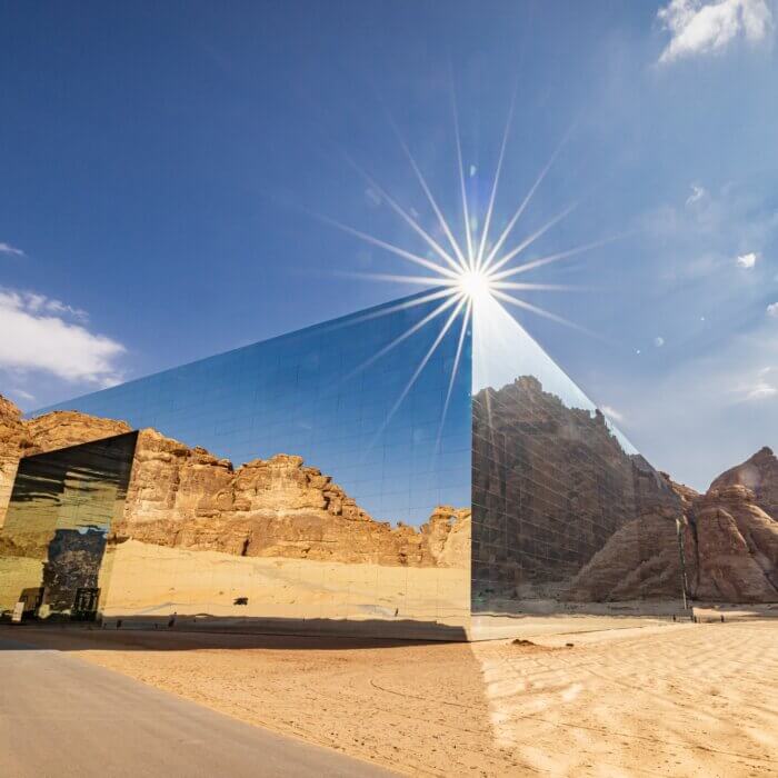 Image shows mountains with desert in foreground in Saudi Arabia